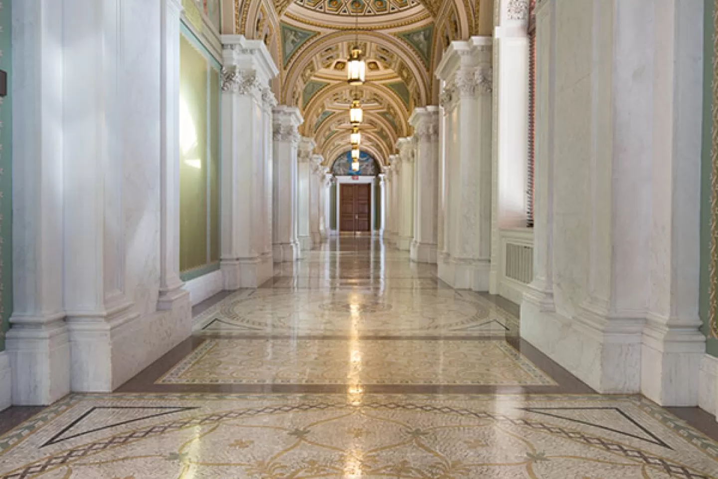 A hallway in the Library of Congress Thomas Jefferson Building with ornate walls, ceiling and floor.