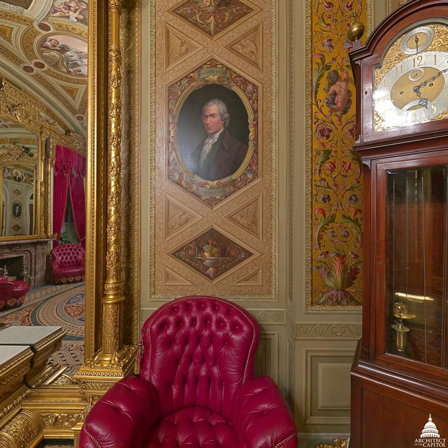A room with a portrait, chair and clock.