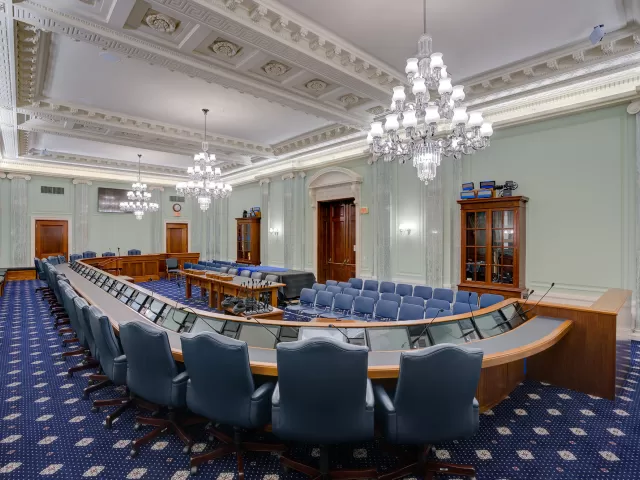 The finished SR-253 hearing room, with the ceiling and plaster reliefs repainted to appear like carved stone, which is truer to the architects' original intention.