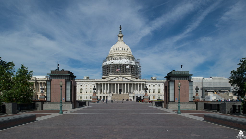 Photo of the U.S. Capitol with it's Dome partially covered in scaffolding.