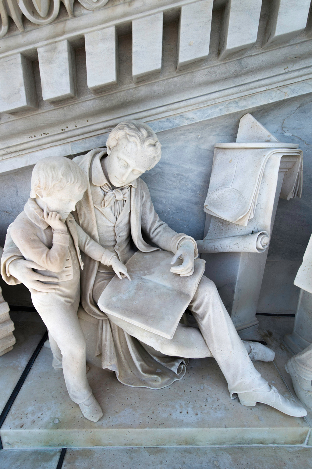 Details on the pediment includes the snappy dress of a school master.