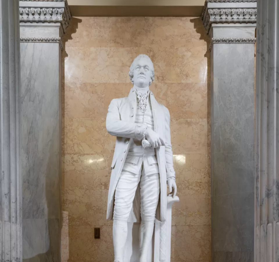 Marble statue of a person standing.