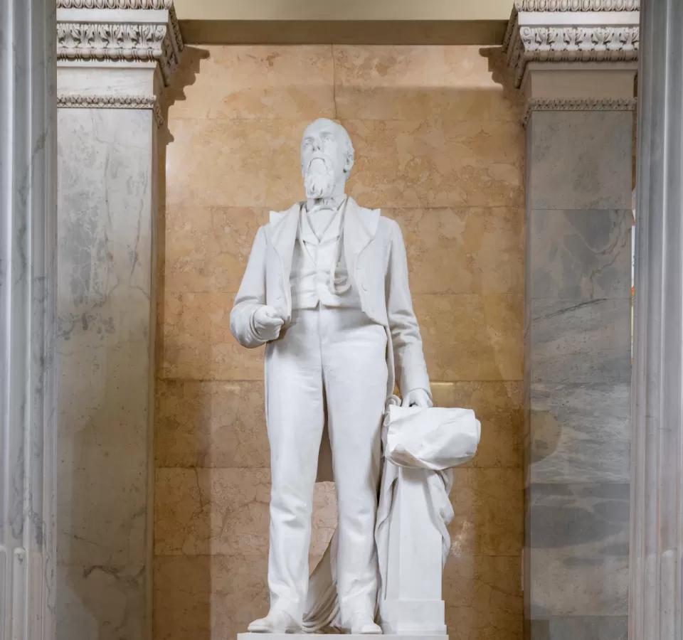 Marble statue of a person standing.