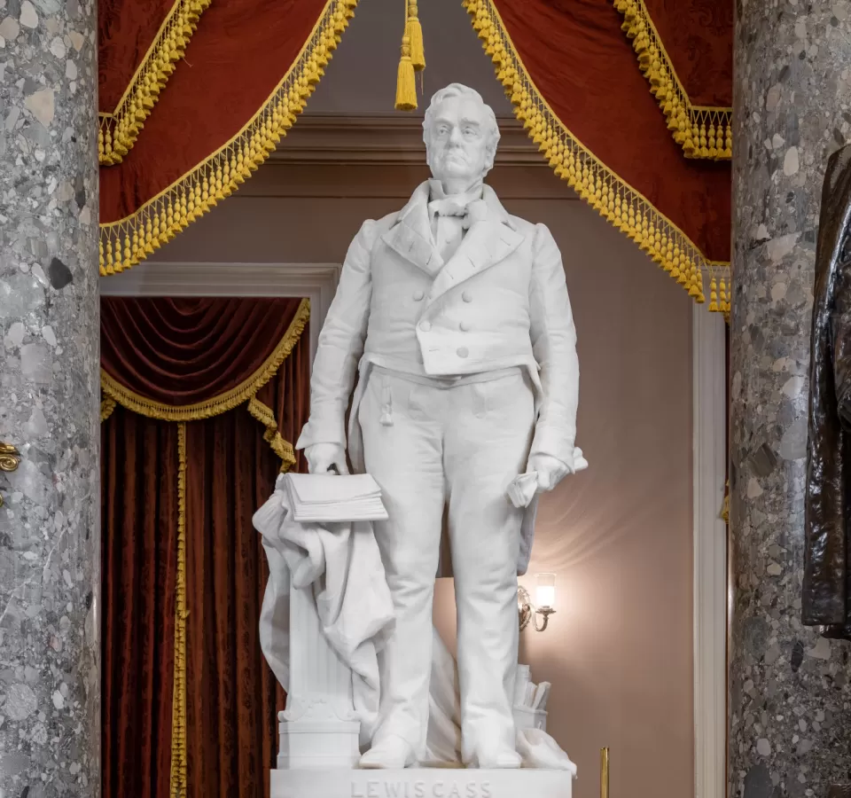 Marble statue of a person standing.