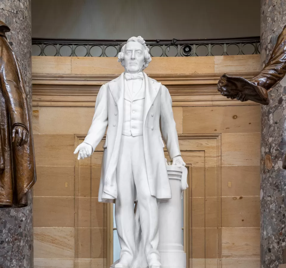 Marble statue of a person standing.