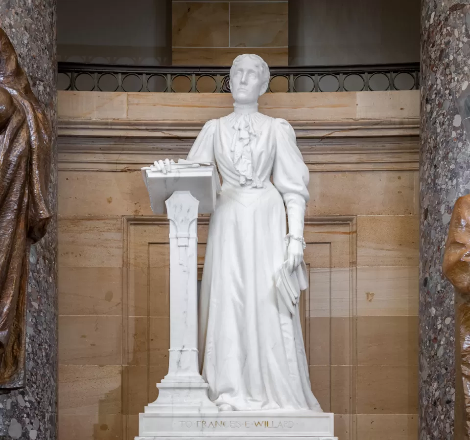 Marble statue of a person standing.