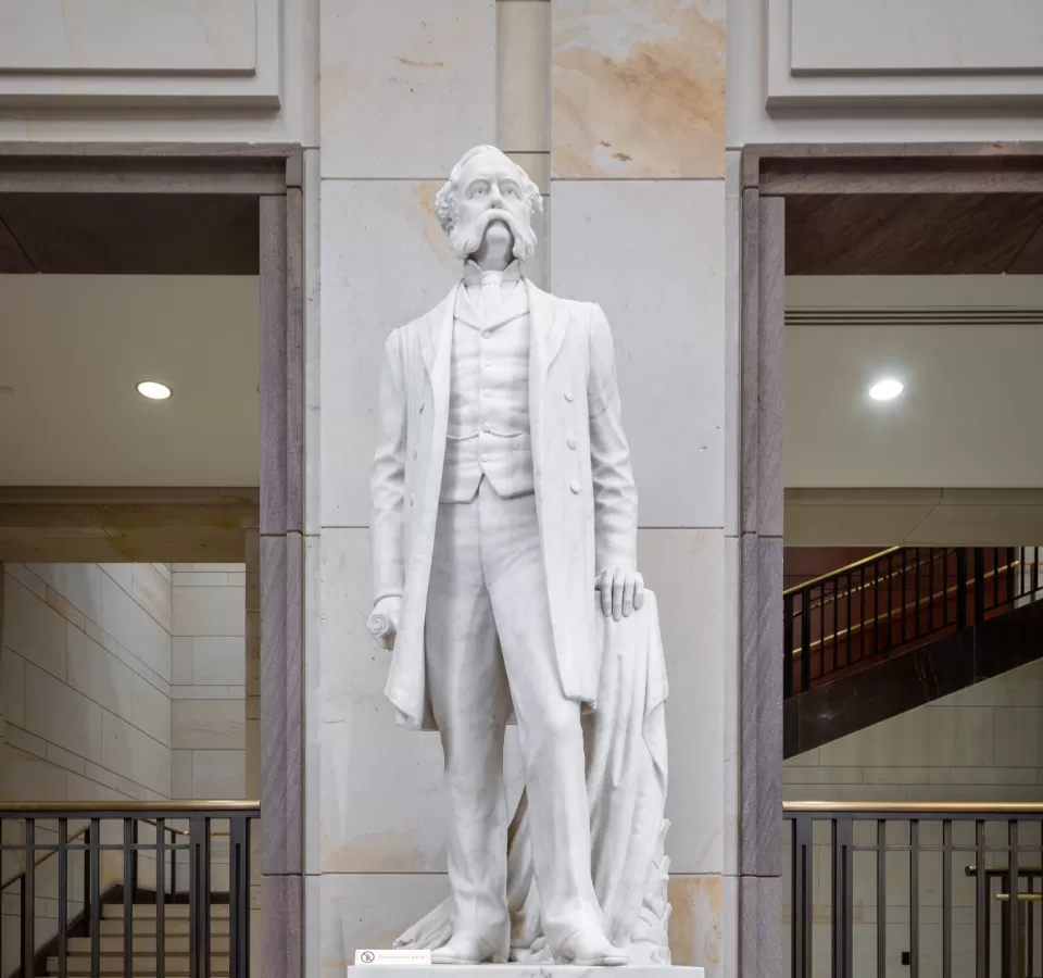 Marble statue of a person standing.