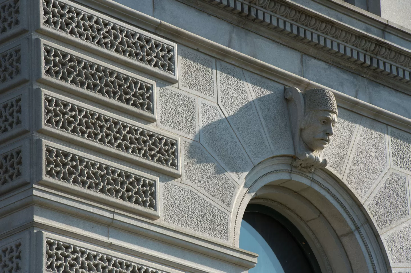 One of the 33 ethnological heads that ornament the keystones of the first-story windows.