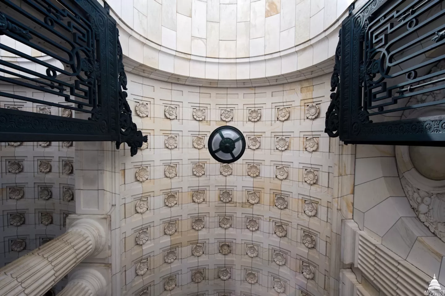 Looking up at the carriage entrance and gates at the Russell Senate Office Building.