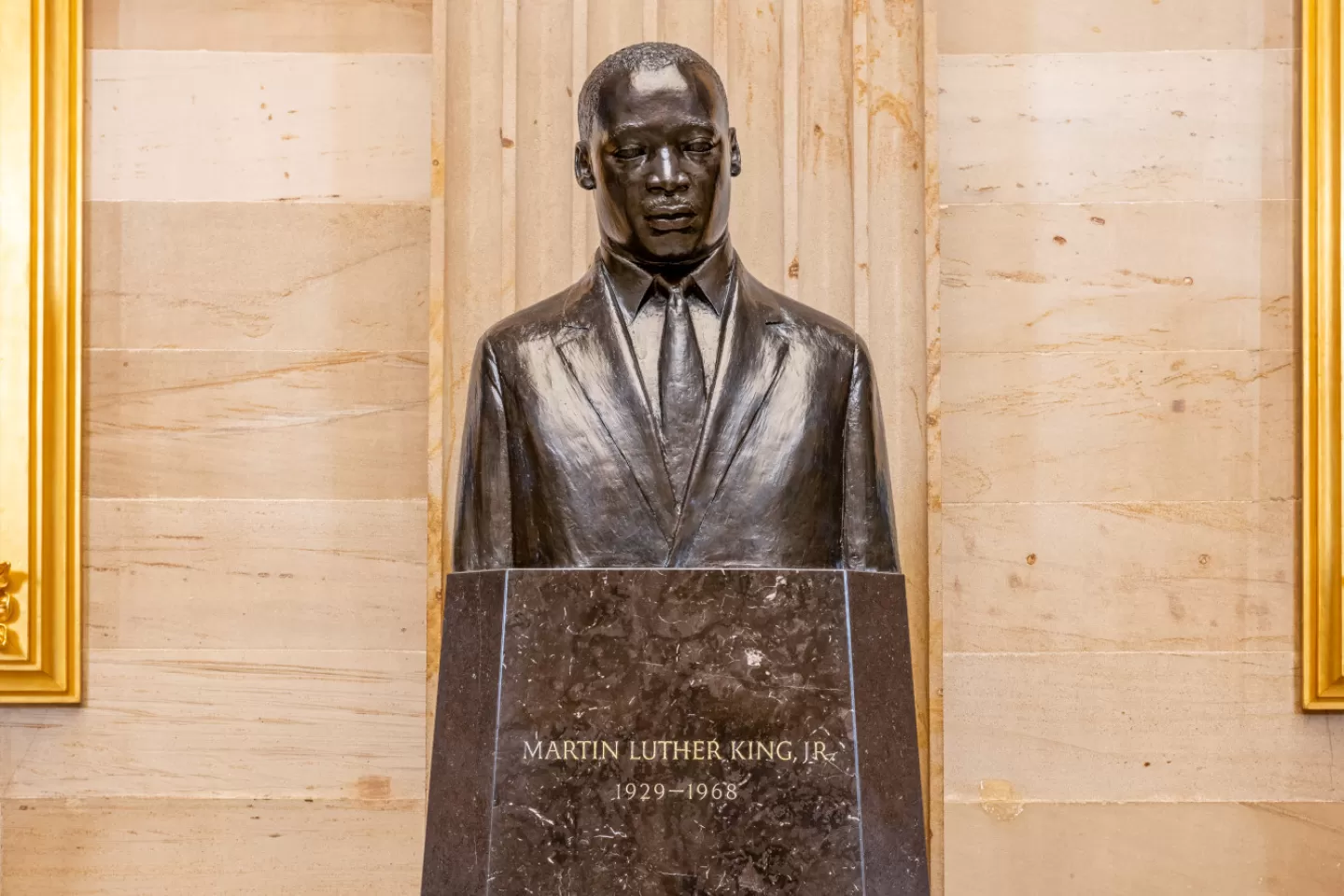 Bronze bust on a pedestal. 