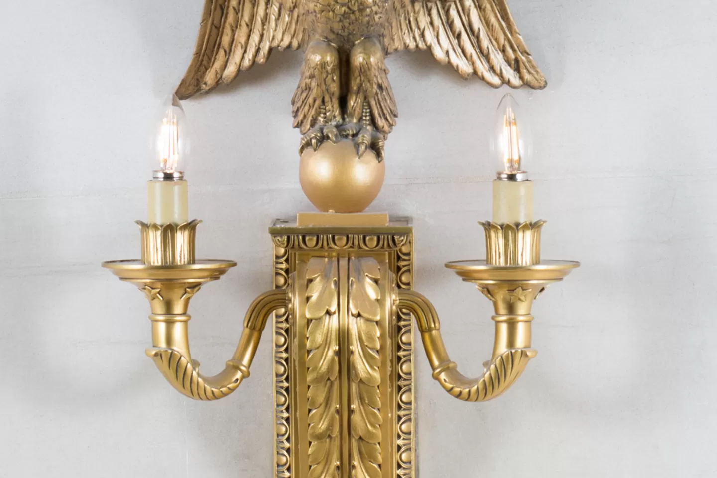 Eagle sconce or wall bracket on staircase walls in the Longworth Building.