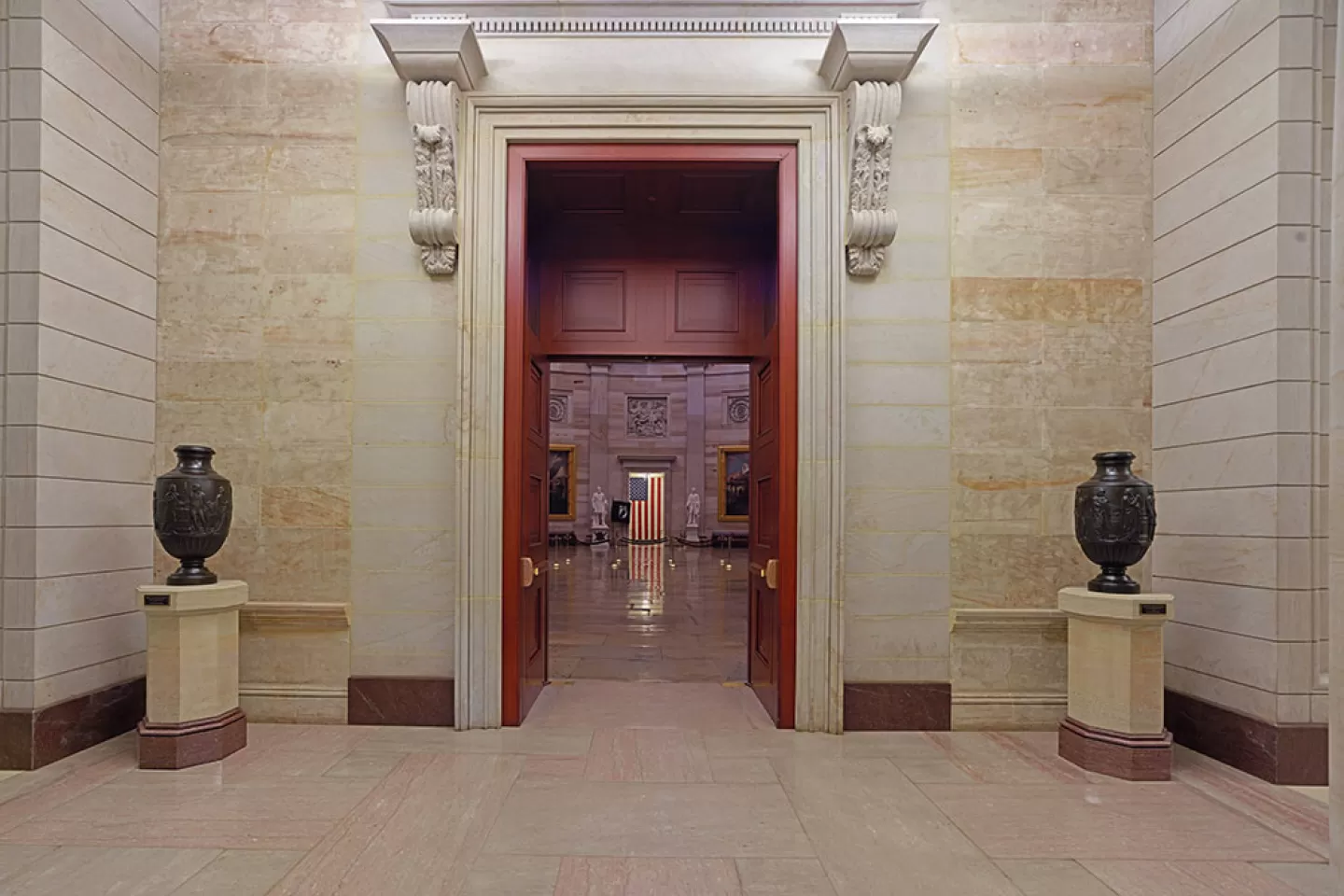 The bronze Federal Vases on display atop sandstone pedestals in the east front vestibule of the U.S. Capitol Rotunda.