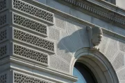 One of the 33 ethnological heads that ornament the keystones of the first-story windows.