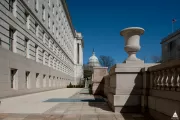 Terrace with balustrade decorated with urns.