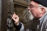 Conservator working on the Amateis Doors.