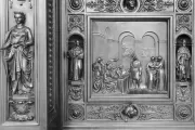 Columbus Doors, Left Valve: Columbus Before the Council of Salamanca (1487)