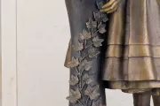 Sculpture of a person's lower body.