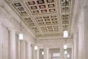 The main corridor, known as the Great Hall, has double rows of monolithic marble columns which rise to a coffered ceiling.