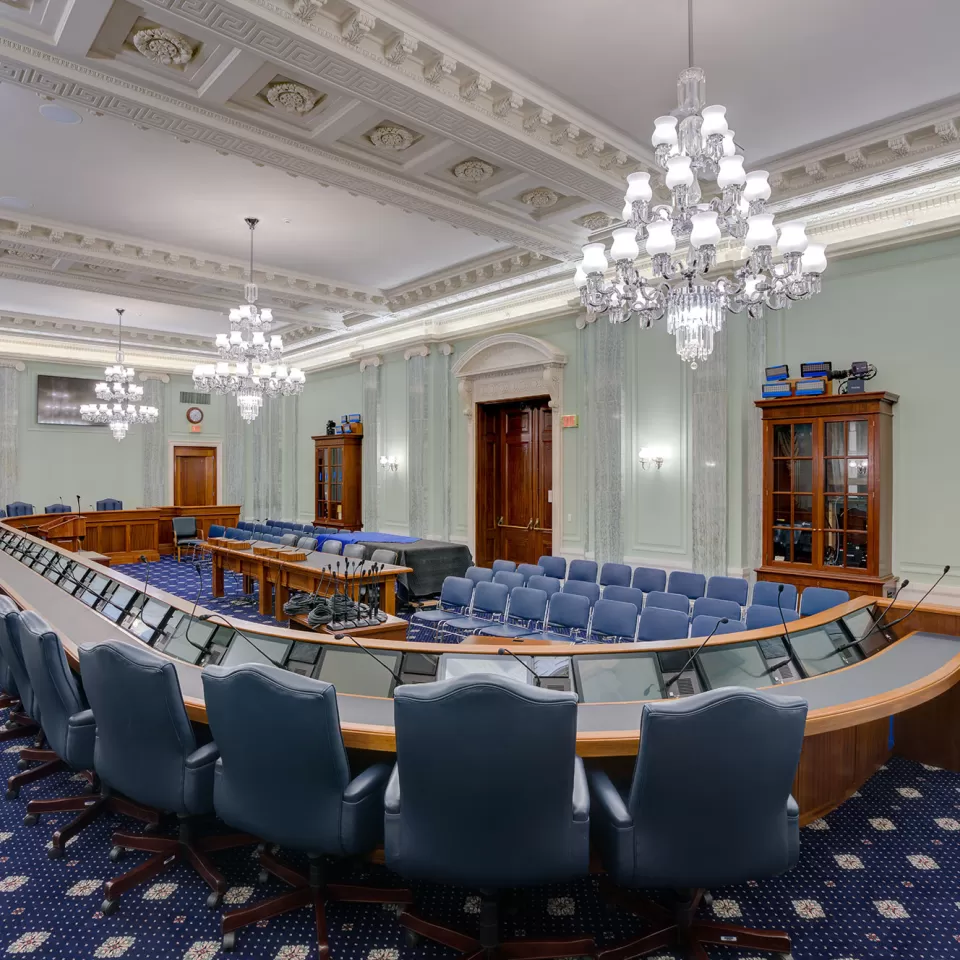 The finished SR-253 hearing room, with the ceiling and plaster reliefs repainted to appear like carved stone, which is truer to the architects' original intention.