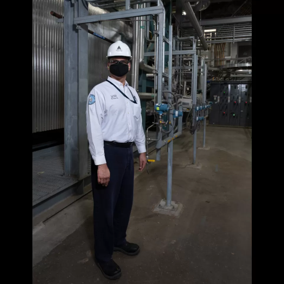 Sequester Team Leader Ladislaus “Dave” Jagoda in front of the cogeneration system at the Capitol Power Plant