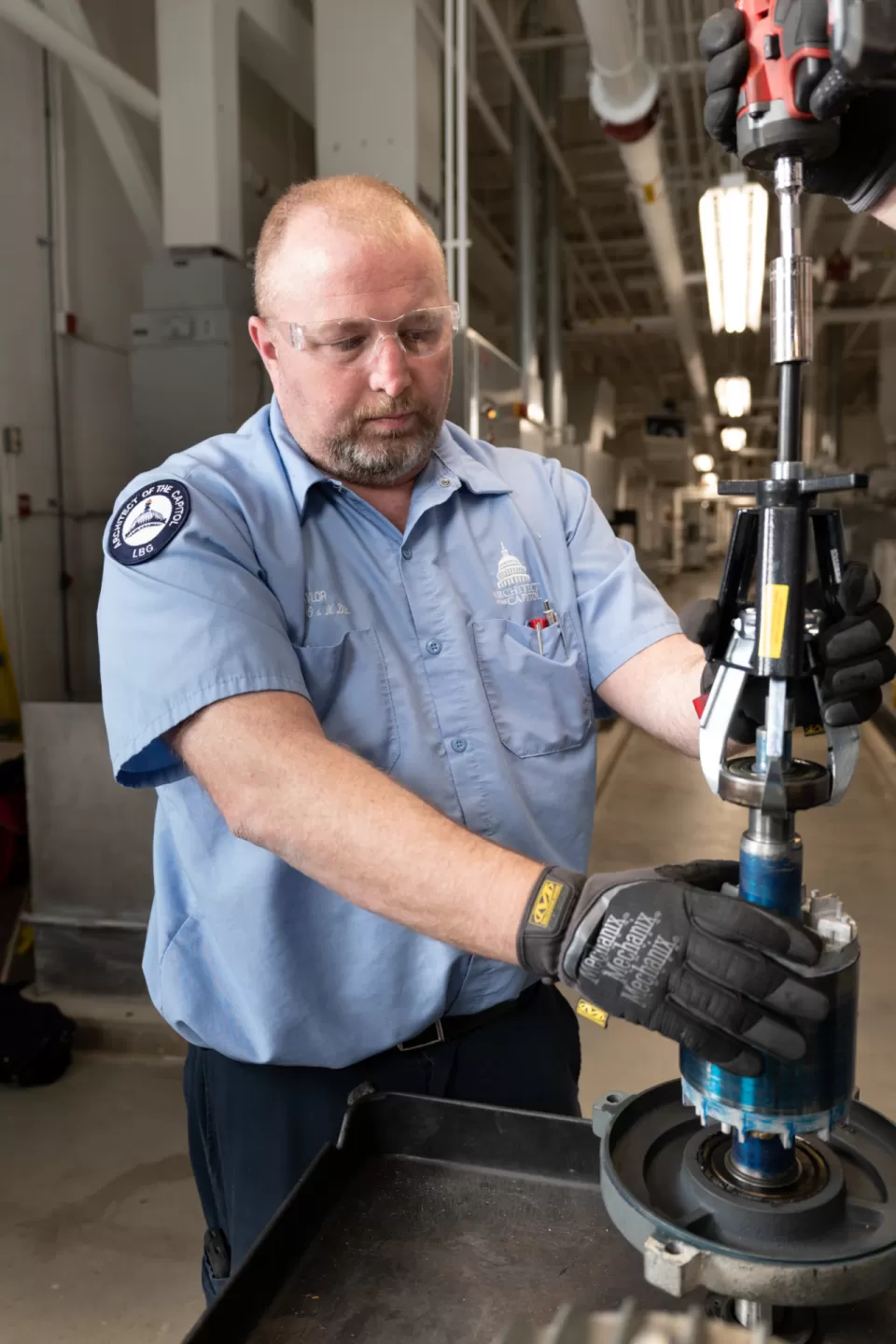 Person standing using equipment.