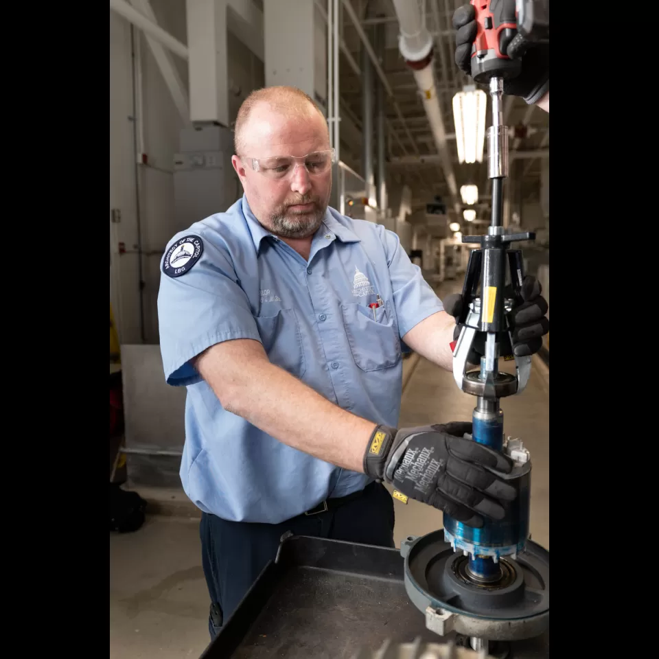 Person standing using equipment.