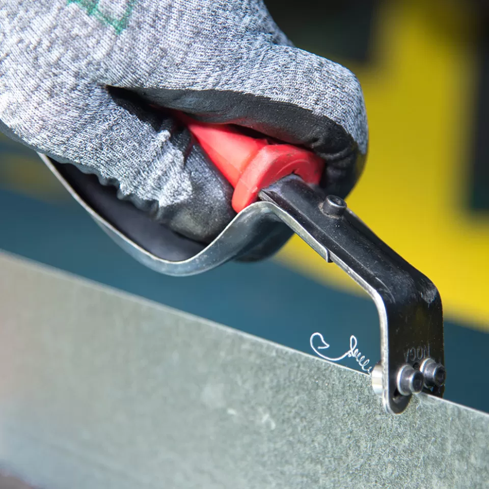 The deburring tool used to remove sharp edges from sheet metal.