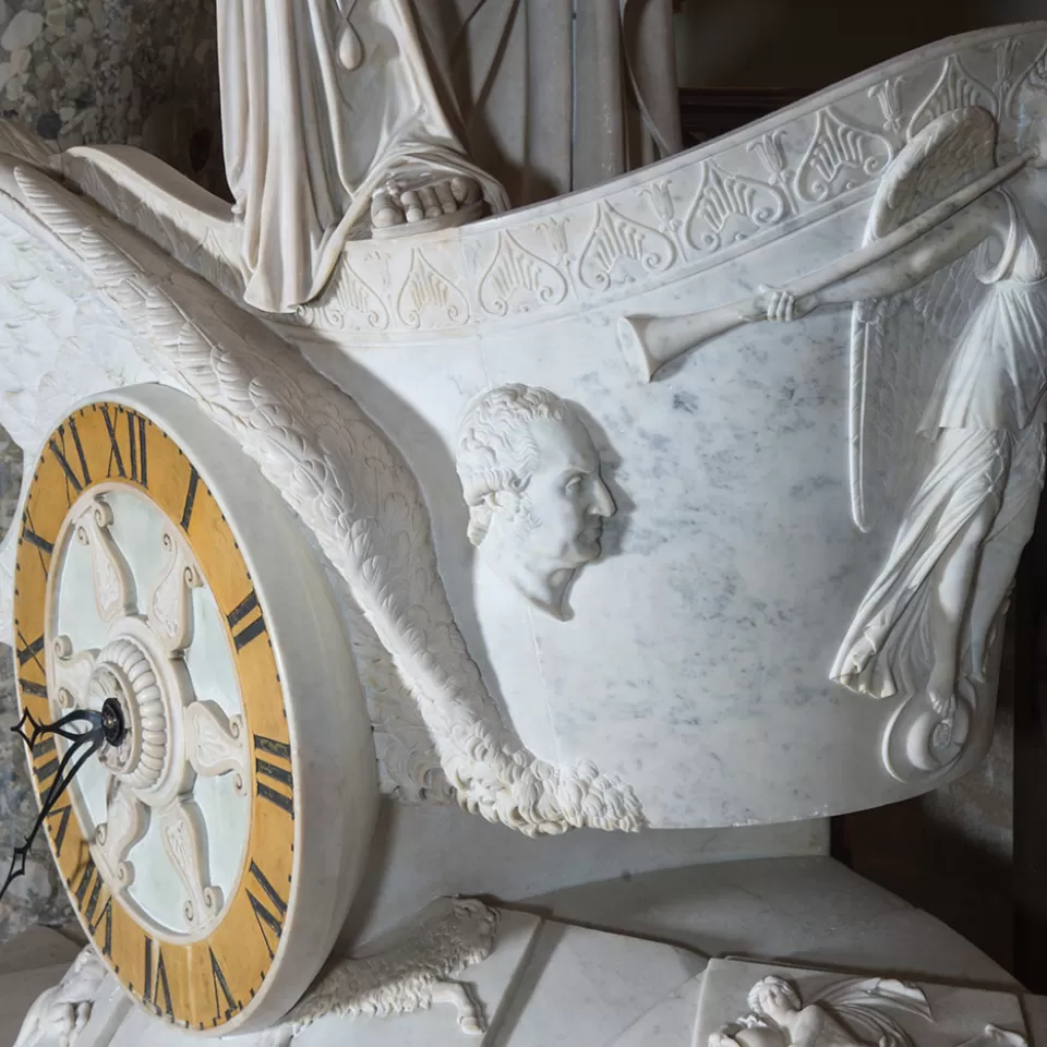 A small bust of George Washington carved into the Car of History marble chariot.