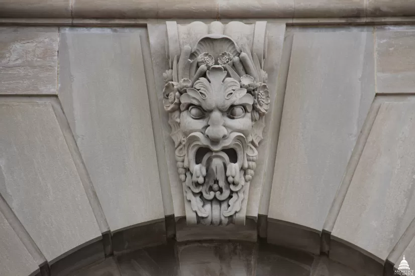 Stone sculpture of a face.