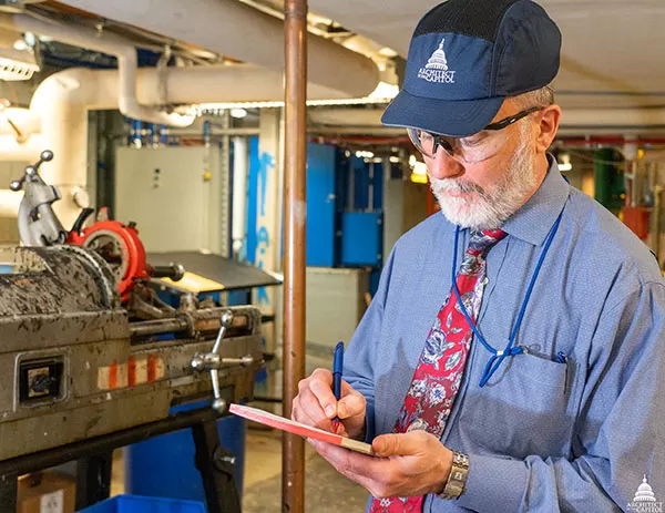 Capitol Building Assistant Superintendent John Deubler documents OSHA violations for abatement during a self-inspection.