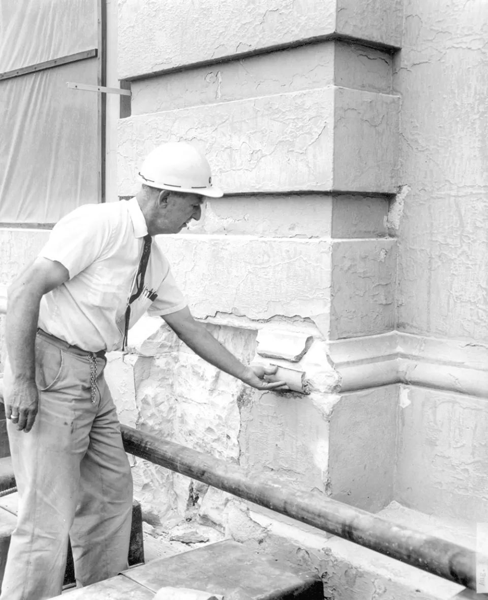Owen Ramsburg, in 1960, surveys stone damage at the Capitol.
