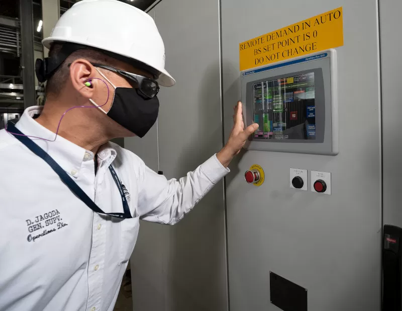 Jagoda at one of the cogeneration system control panels