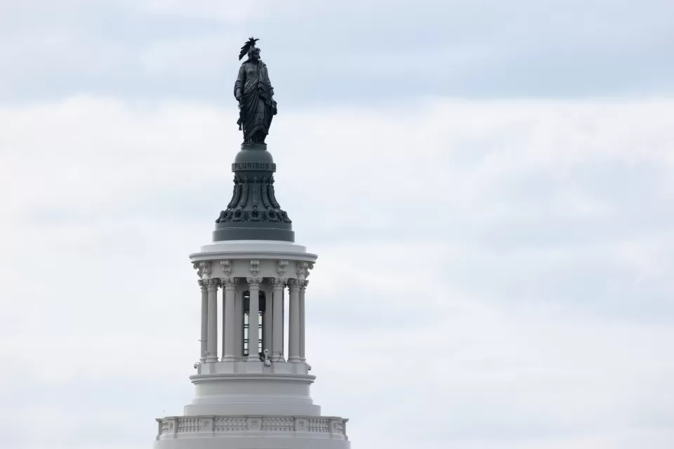 Statue of a figure standing.