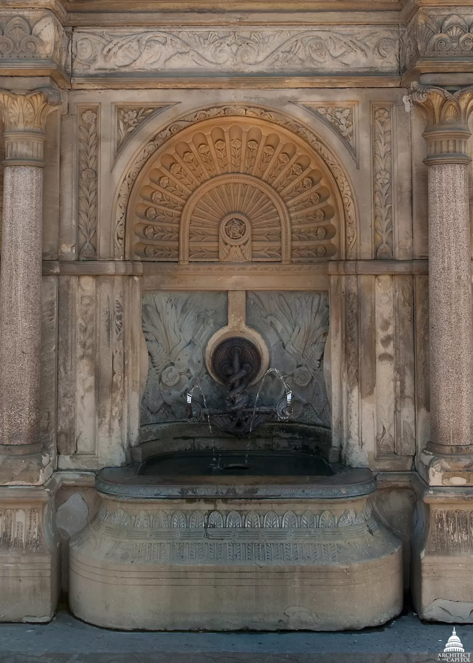 The central fountain in the perimeter wall surrounding Capitol Square.