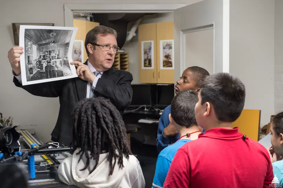 Dunn teaches children about working as a professional photographer.