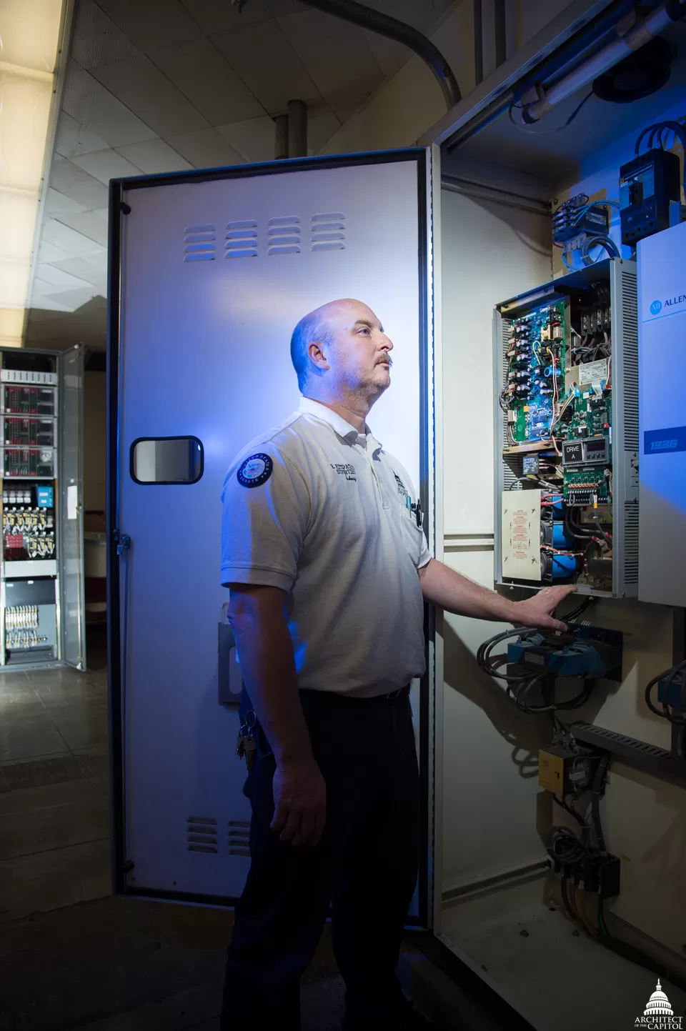 Eric Fitzpatrick looks over the frequency drives for the subway system to the Hart and Dirksen Buildings.