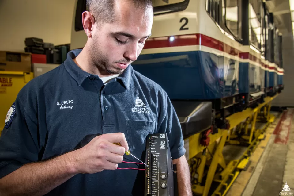 Brian Crupi works on a switch control cabinet which allows operators to move a subway car to the Hart and Dirksen Buildings from one track to the other for maintenance work.