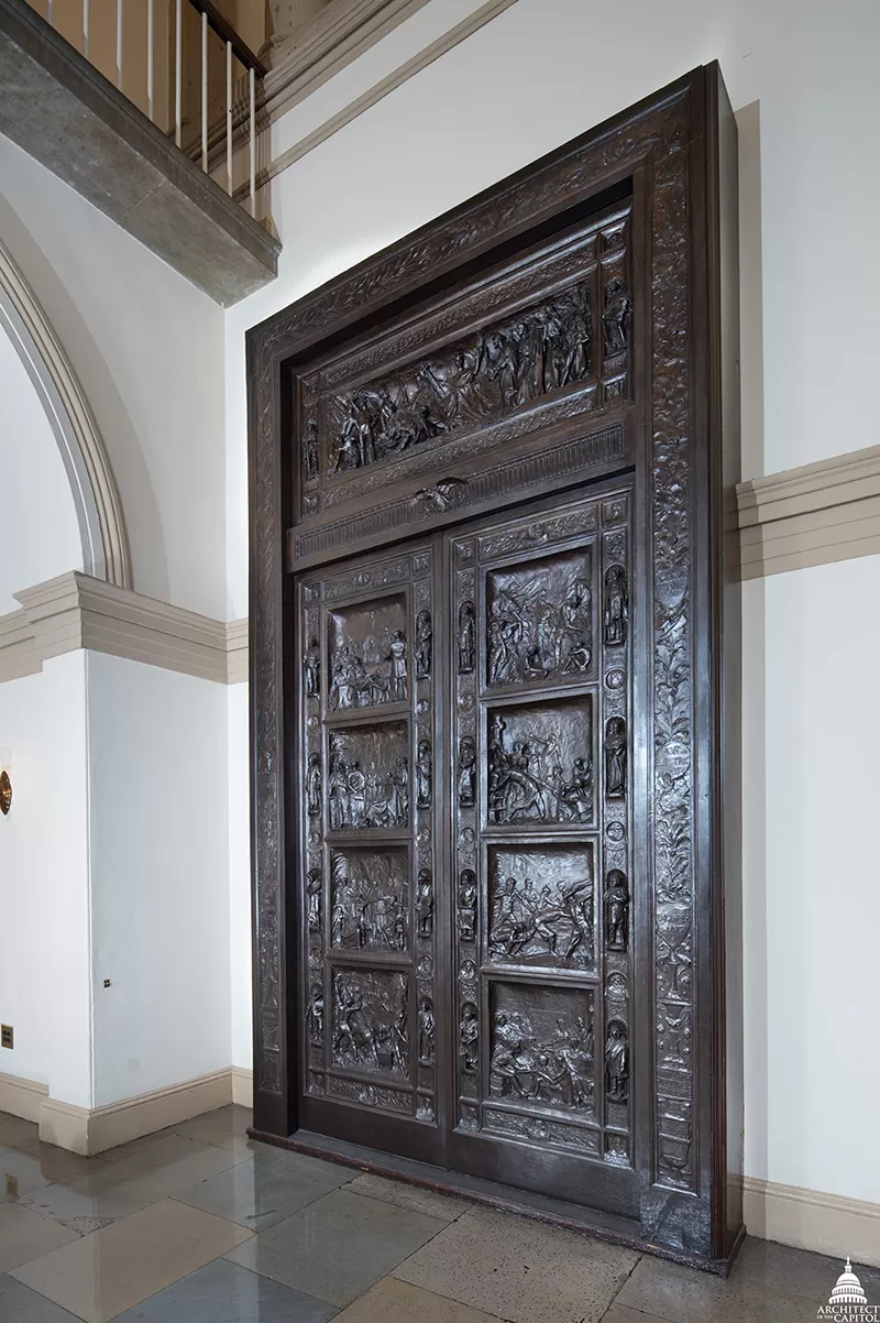 The bronze Amateis Doors on display in the House Wing of the U.S. Capitol.