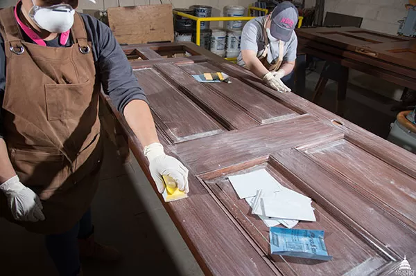 Historic Cannon Building door mid-preservation process.