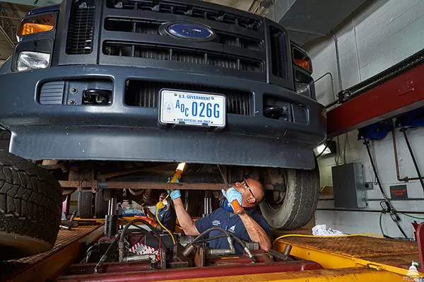 Methodically inspecting an AOC vehicle.