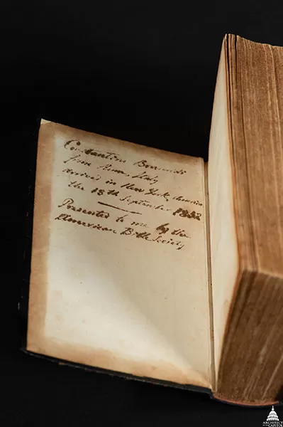 This Bible once belonged to Constantino Brumidi, a U.S. Capitol artist. The cover is open showing Brumidi's inscription.