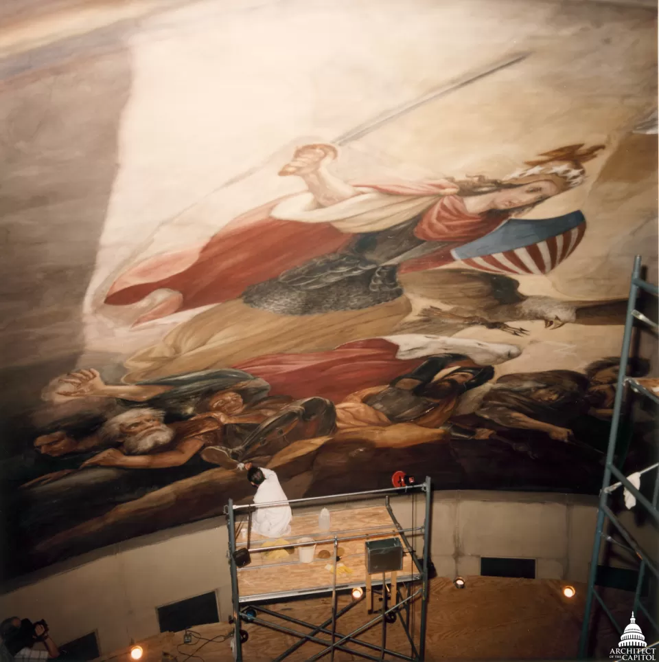 Person working on a mural.