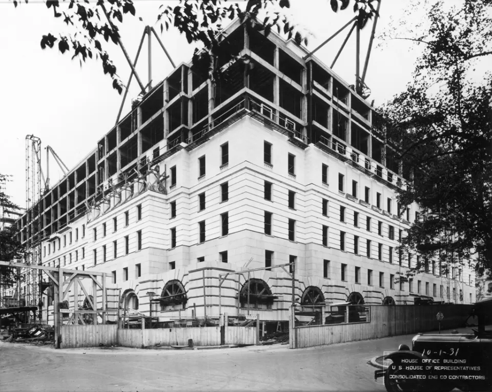 Construction progress of the Longworth Building's frame work and stone work from the corner of South Capitol and C streets SE, October 1931.