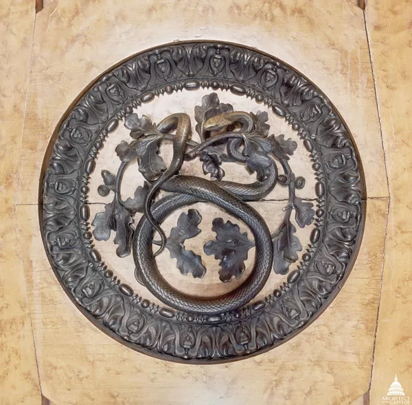Bronze door handle on maple doors to the chamber of the House of Representatives in the shape of a snake. 