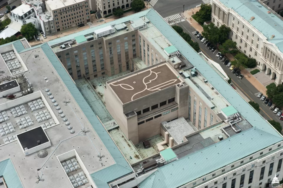 The pathways of the Dirksen Building green roof make a design with the U.S. Capitol Dome on the left, the Washington Monument on the right and a leaf in the bottom left corner.