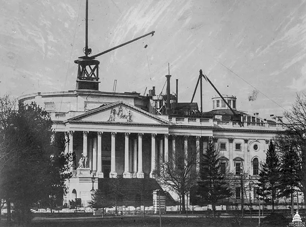 Dome construction from the East Front with the crane rising above the original sandstone Rotunda walls.