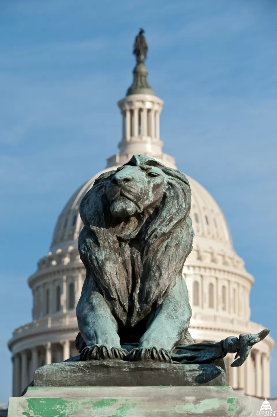 Grant Memorial lion before restoration, with the Capitol Dome in the background.