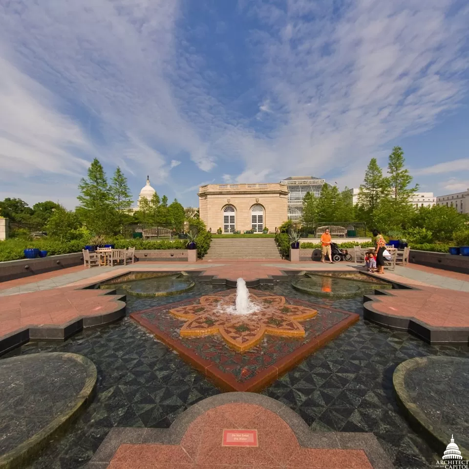 The First Ladies Water Garden in National Garden with the Capitol Dome in the background.