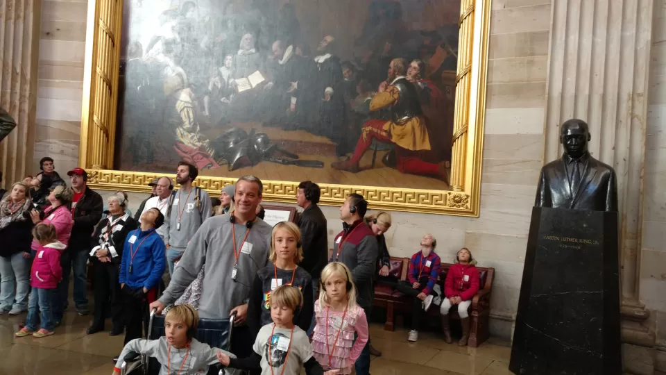 Barry's son Andrew and his four kids, Timothy, Ariana, Nicholas and Matthew, in front of their great grandfather William Brewster twelve generations removed.