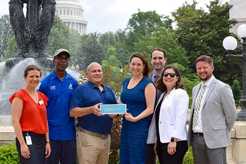 Members of the U.S. Botanic Garden and U.S. Green Building Council in Bartholdi Park with the SITES Gold Certification.